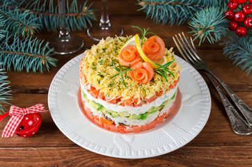 Layered salad with salmon, avocado and cream cheese