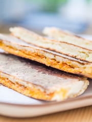 Bolo levedo, typical bread from Azores, grilled with cheese and choriso