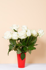 white roses in vase