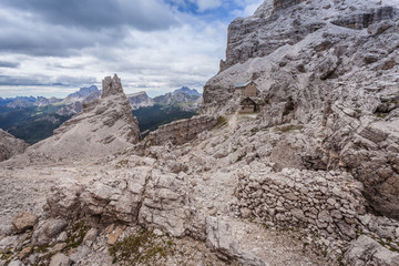 Fototapeta na wymiar View of Cantore mountain hut ruines and first world war posts near Fontananegra Pass, theater of fierce fighting in 1915 - 16, Tofane, Dolomites, Italy