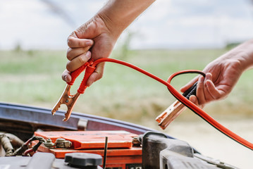 The driver tries to start a car