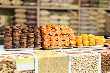 Pile of dried fruits, dried apricots prepared in various ways ar market or store