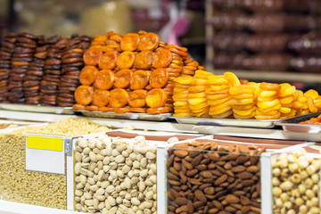 Pile of dried fruits, dried apricots prepared in various ways ar market or store