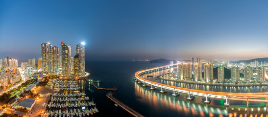 Panorama of Busan city skyline view at Haeundae district, Gwangalli Beach with yacht pier at Busan,...