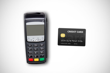 Payment terminal and credit card on white background
