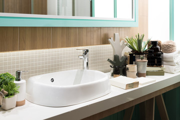 Interior of bathroom with sink basin faucet and mirror. Modern design of bathroom.