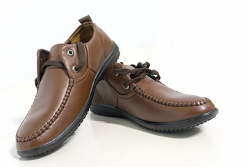 Men's brown shoes on white background