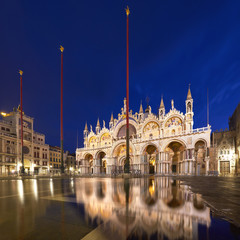 Fototapeta na wymiar Basilica in San Marco square in Venice with reflection at twilight
