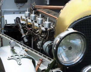 Engine radiator and headlamps on a vintage car