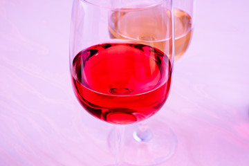 Two glasses with white and red wine