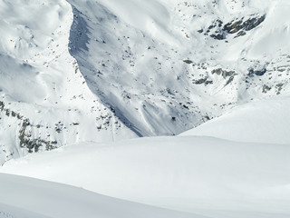 Fototapeta na wymiar snowed hills and rocks in Switzerland