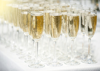 A number of glasses full of champagne