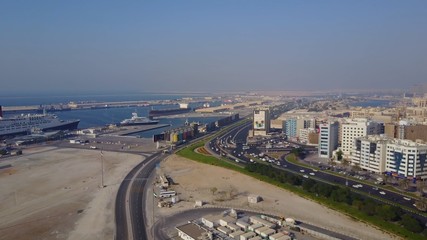 Fototapeta premium Highway on Dubai. Aerial view of The World Islands in Dubai. The islands were intended to be developed with hotel complexes and luxury villas, like The Palm is