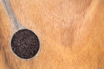Acai powder on wooden spoon (Euterpe oleracea)