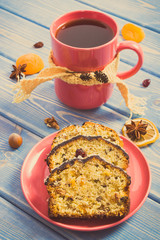 Vintage photo, Cup of tea and fresh baked fruitcake on plate