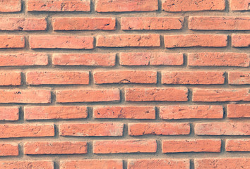 Obraz premium Old grunge brick wall background, Common sight in the local city. Use for design and texture. Vintage tone.