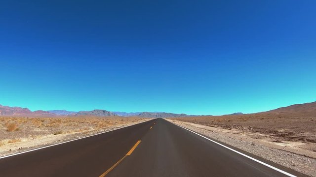 Driving through Death Valley National Park - endless streets in the desert