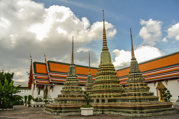 Fototapeta premium Pagoda is in Wat Pho that was named as the temple of the pagoda or chedi that are decorated with yellow glaze or glazed tiles or dark blue. 