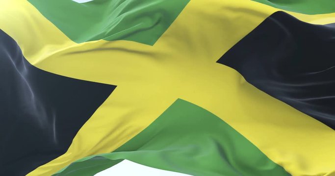 Jamaican flag waving at wind with blue sky in slow, loop