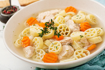 Dietary soup with turkey or chicken fillet with pasta Ruote and herbs