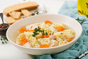Dietary soup with turkey or chicken fillet with pasta Ruote and herbs