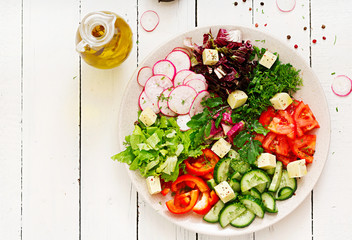 Mix salad from fresh vegetables and greens herbs. Dietary menu. Proper nutrition. Healthy lifestyle. Flat lay. Top view