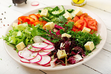 Mix salad from fresh vegetables and greens herbs. Dietary menu. Proper nutrition. Healthy lifestyle.