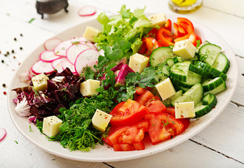 Mix salad from fresh vegetables and greens herbs. Dietary menu. Proper nutrition. Healthy lifestyle.