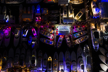 Boats at a marina lit at night