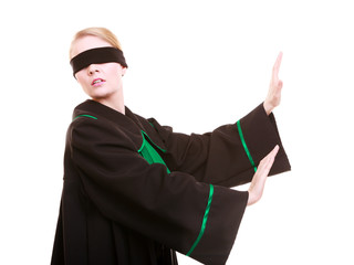 Woman lawyer attorney in polish black green gown with blindfold