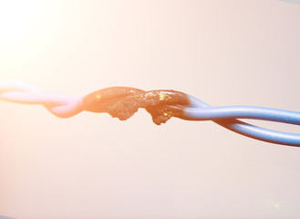 A short circuit, a burned cable, against a light background. fire wiring. faulty cable