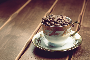 fresh coffee beans. cup on a wooden background