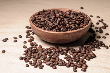 fresh coffee beans.coffee in a wooden bowl.