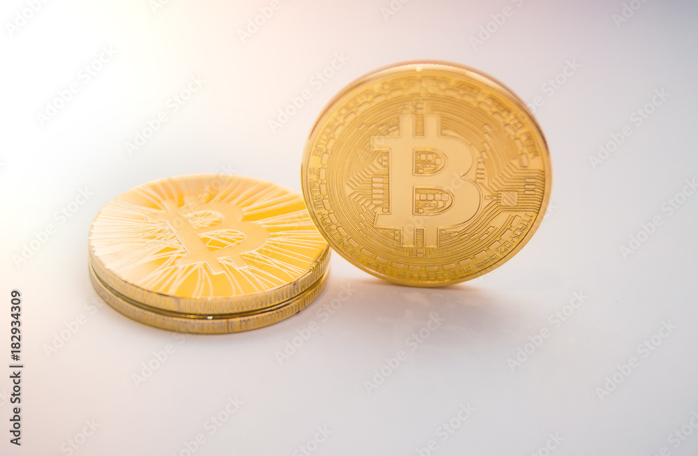 Wall mural golden bitcoin on isolated white background. concept development. gold currency