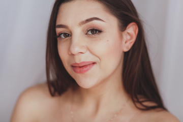 Studio portrait of a beautiful young caucasian woman smiling