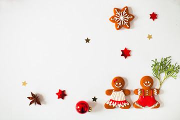 Christmas composition with fir tree branches and holiday ornament on white background. Flat lay, top view.