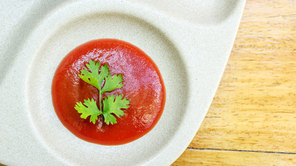 ketchup on a wooden table.