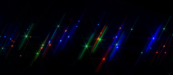 Obraz premium A black background with sparkling stars in the lights