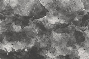 abstract black splashes on watercolor paper. monochrome image.