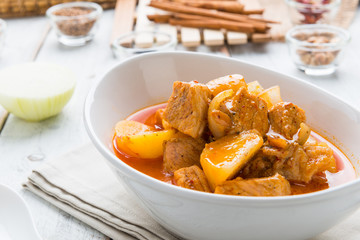 Massaman pork curry on wood background. Coconut milk curry.