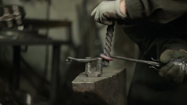 Blacksmith at work in his workshop