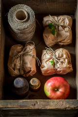 Fototapeta na wymiar Tasty take away apple pie packed in a grey paper