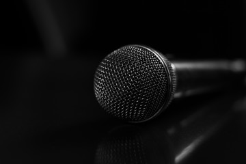 black-and-white photo of the microphone on a glossy surface