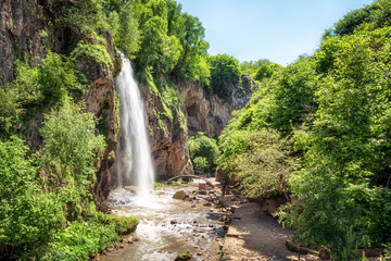 Fototapeta na wymiar Waterfall Medovyi on river Alikonovka, Karachay Cherkessia, Russian Federation.