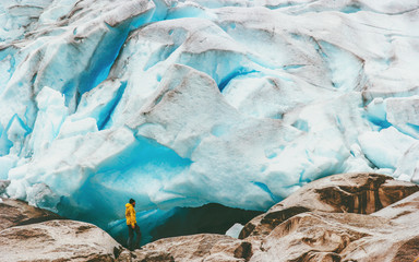 Man hiking at Nigardsbreen glacier  Travel Lifestyle concept adventure extreme vacations outdoor...