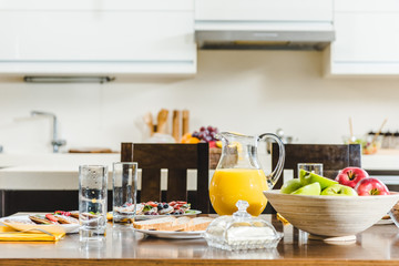 pancakes, juice and bowl with fruits on table