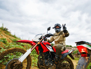 Motocross racers on landscape © Georgii