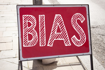 Obraz premium Conceptual hand writing text caption inspiration showing Bias. Business concept for Prejudice Biased Unfair Treatment written on announcement road sign with background and copy space