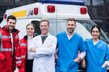 happy ambulance doctors working team standing in front of car © LIGHTFIELD STUDIOS