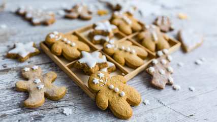 Homemade Christmas gingerbread cookies on wooden background.